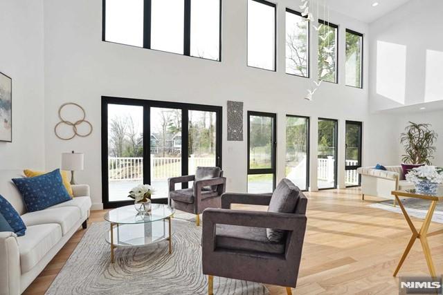 living area featuring plenty of natural light, recessed lighting, and wood finished floors