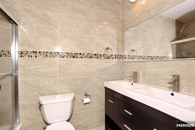 full bath with toilet, tasteful backsplash, tile walls, tiled shower, and vanity