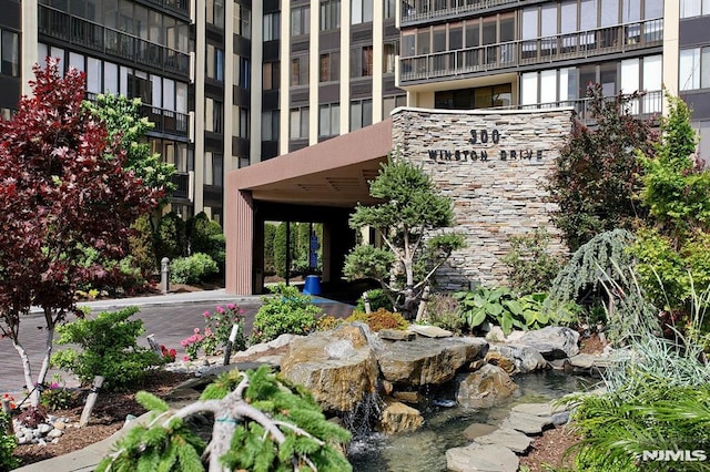 exterior space featuring a garden pond