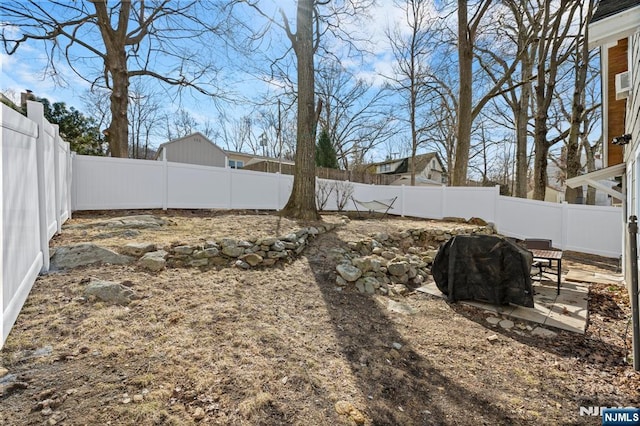 view of yard with a fenced backyard and a patio area