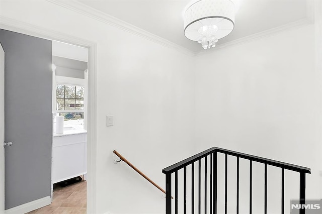 stairs with baseboards, an inviting chandelier, crown molding, and tile patterned flooring