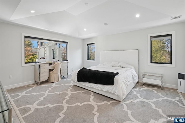 bedroom with recessed lighting, visible vents, multiple windows, and baseboards