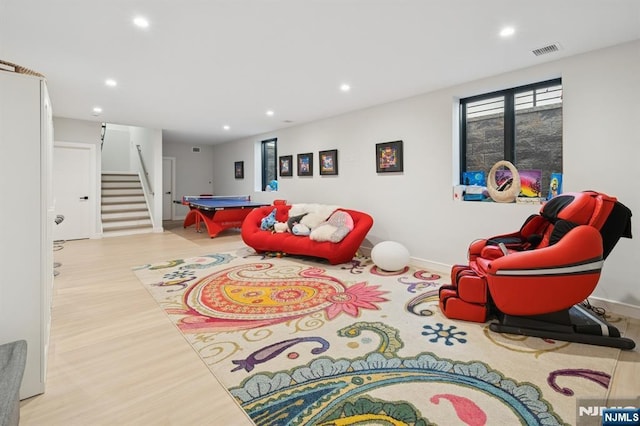 playroom with wood finished floors, recessed lighting, visible vents, and baseboards