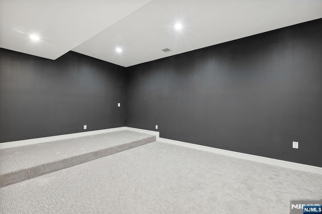 interior space featuring visible vents, recessed lighting, carpet, and baseboards