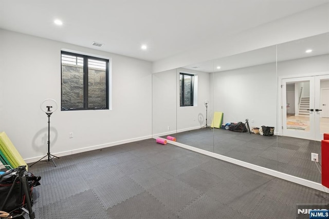 exercise room with recessed lighting, visible vents, french doors, and baseboards