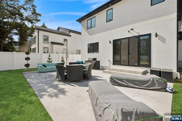 view of patio featuring an outdoor hangout area, outdoor dining area, entry steps, and fence