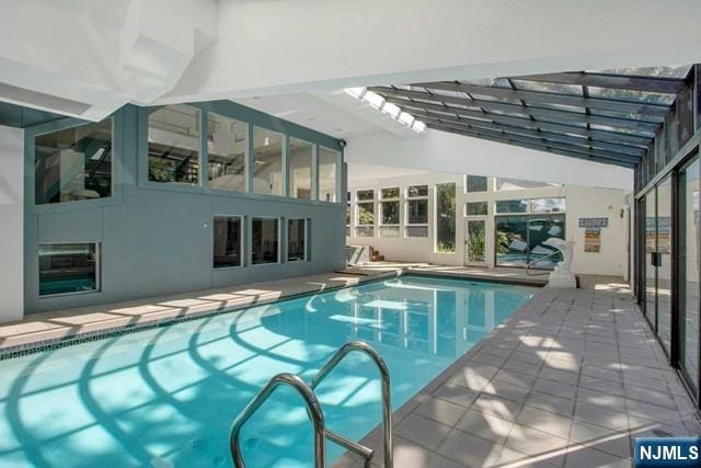 indoor pool with a patio