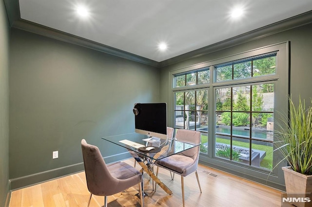 home office featuring visible vents, ornamental molding, recessed lighting, light wood finished floors, and baseboards