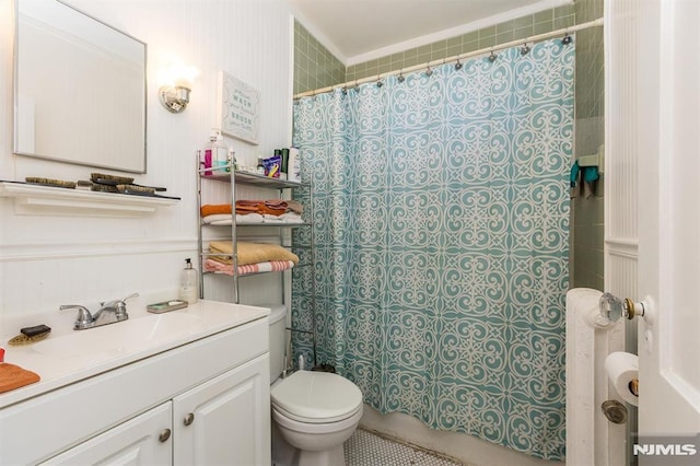 full bathroom with vanity, a shower with shower curtain, and toilet