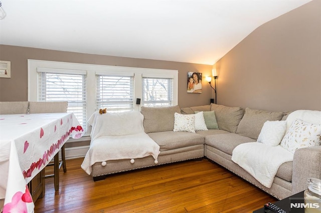 living room with lofted ceiling and hardwood / wood-style flooring