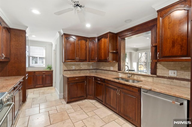 kitchen with stone tile floors, a sink, dishwasher, crown molding, and range