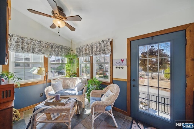 sunroom / solarium featuring vaulted ceiling and a ceiling fan