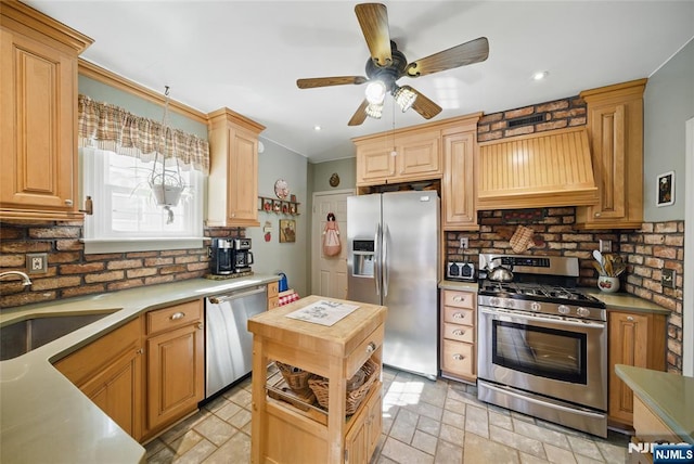 kitchen with a sink, stone tile floors, stainless steel appliances, decorative backsplash, and custom exhaust hood