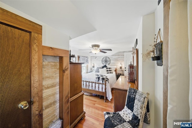 bedroom with a ceiling fan and light wood finished floors