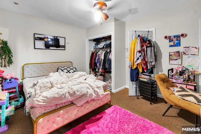 bedroom featuring a ceiling fan, a closet, and baseboards