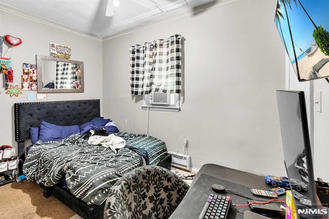 bedroom featuring a ceiling fan, cooling unit, carpet, crown molding, and a baseboard radiator