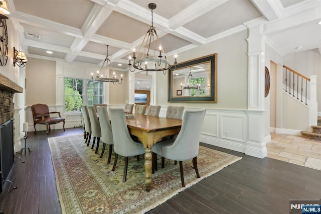 dining space with beamed ceiling, coffered ceiling, and a notable chandelier