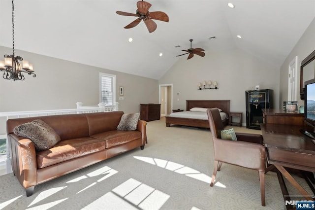 living area with carpet flooring, a healthy amount of sunlight, and ceiling fan with notable chandelier