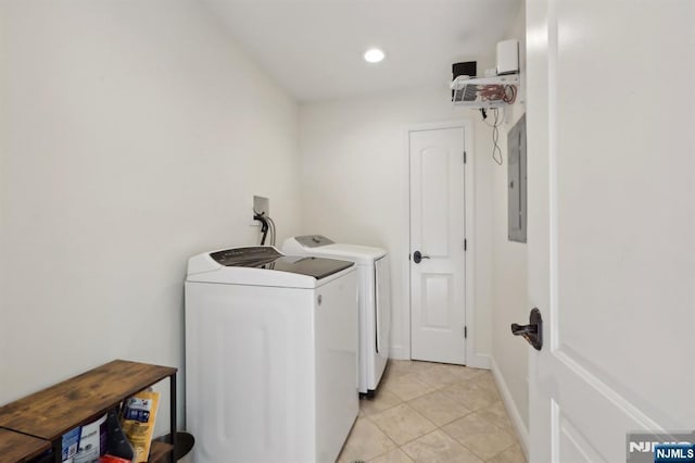 laundry room featuring laundry area, recessed lighting, washer and clothes dryer, electric panel, and light tile patterned floors