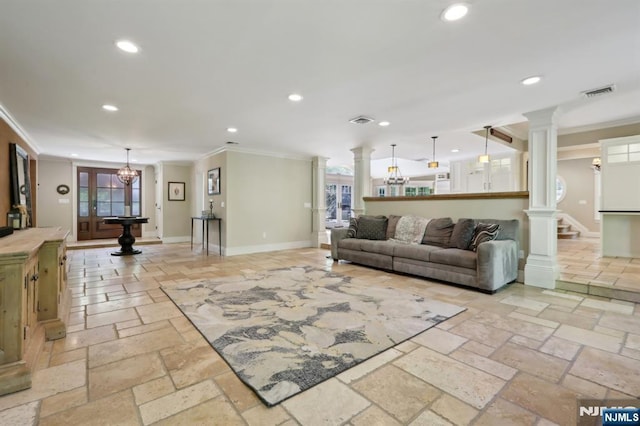 living room featuring decorative columns, visible vents, stone tile flooring, ornamental molding, and recessed lighting
