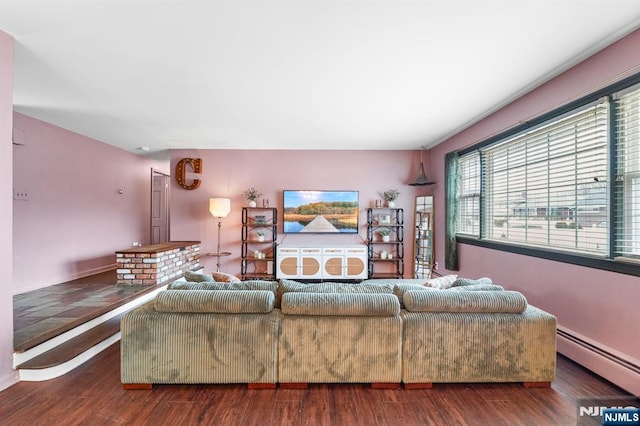 living room with wood finished floors and baseboard heating