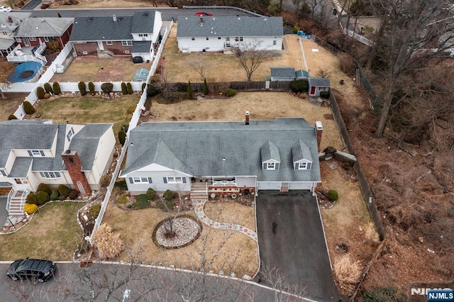 birds eye view of property with a residential view