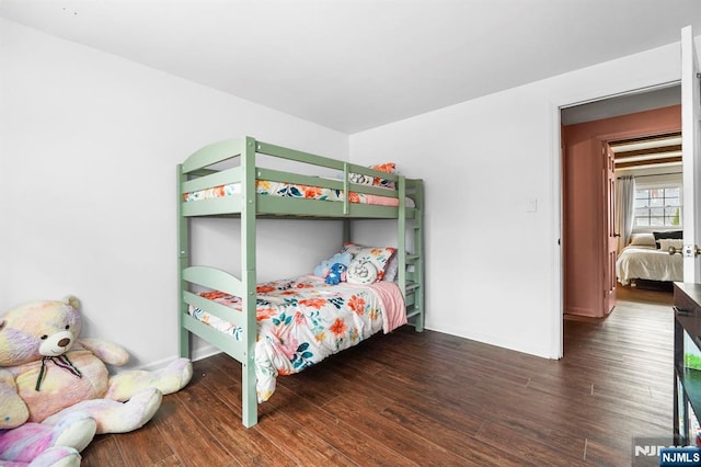 bedroom with wood finished floors