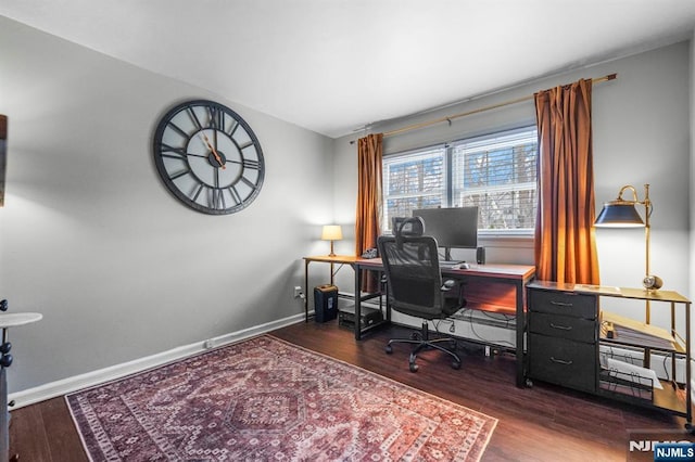 office space with baseboards and wood finished floors