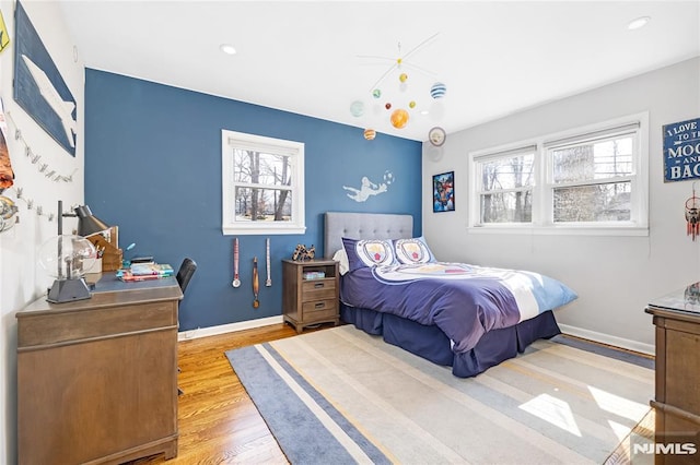 bedroom featuring recessed lighting, baseboards, and wood finished floors