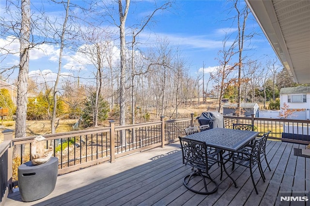 deck with outdoor dining area