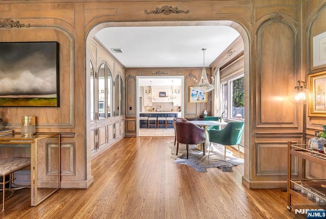 28 Scott Ct, Allendale, NJ 07401 - dining space with a decorative wall, wood finished floors, and arched walkways