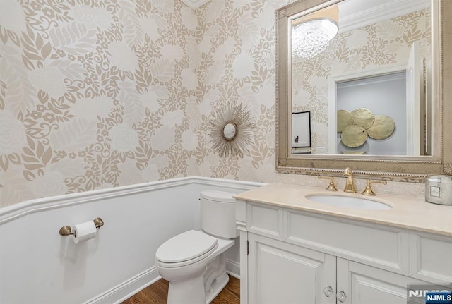 28 Scott Ct, Allendale, NJ 07401 - bathroom featuring wallpapered walls, wainscoting, toilet, wood finished floors, and vanity