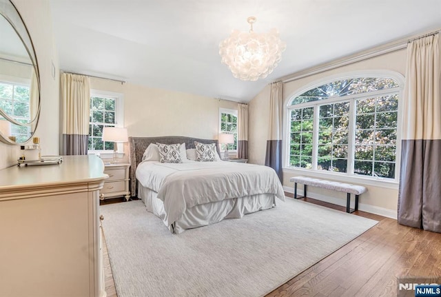 28 Scott Ct, Allendale, NJ 07401 - bedroom with a chandelier, light wood-style flooring, and baseboards