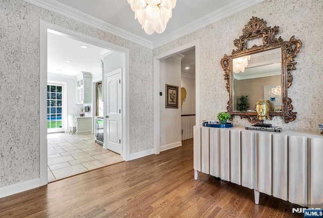28 Scott Ct, Allendale, NJ 07401 - hall with wallpapered walls, ornamental molding, a chandelier, wood finished floors, and baseboards