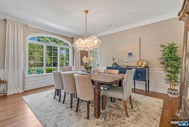 28 Scott Ct, Allendale, NJ 07401 - dining area with a chandelier, ornamental molding, wood finished floors, wainscoting, and a decorative wall