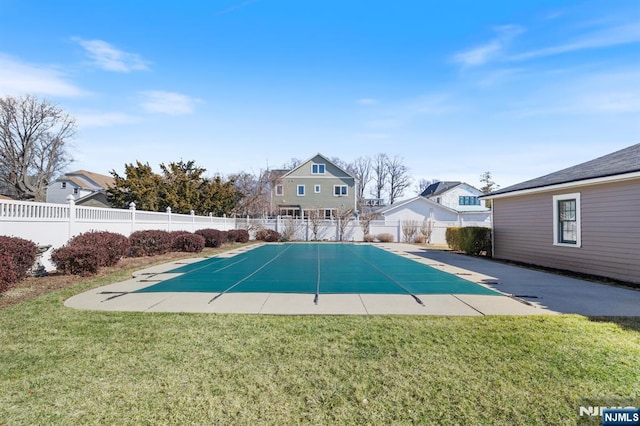 view of pool with a fenced in pool, a yard, and fence