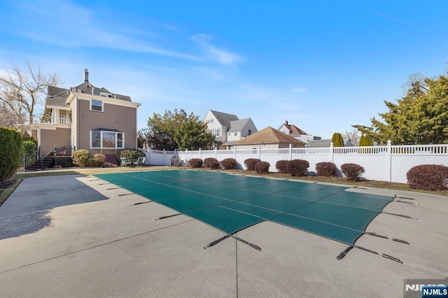 view of pool featuring a fenced in pool, a patio, and a fenced backyard