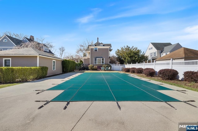 view of pool with fence