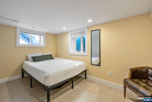 bedroom featuring recessed lighting and baseboards