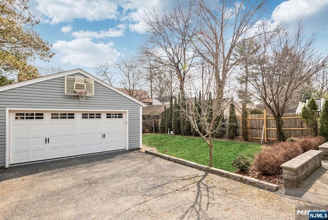 garage featuring fence