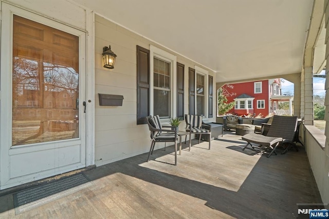 view of patio featuring a porch