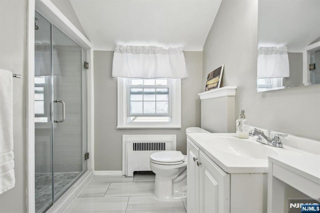 bathroom featuring radiator, a stall shower, vanity, and toilet