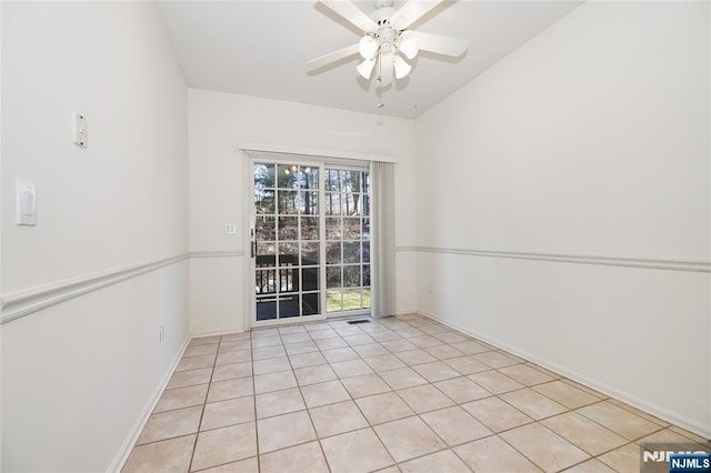 unfurnished room with baseboards and ceiling fan