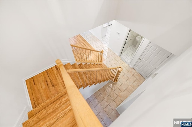 staircase featuring tile patterned floors