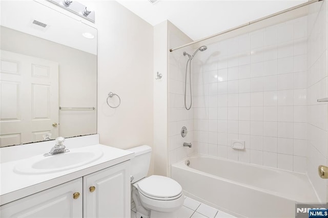 full bath with visible vents, toilet, washtub / shower combination, tile patterned flooring, and vanity