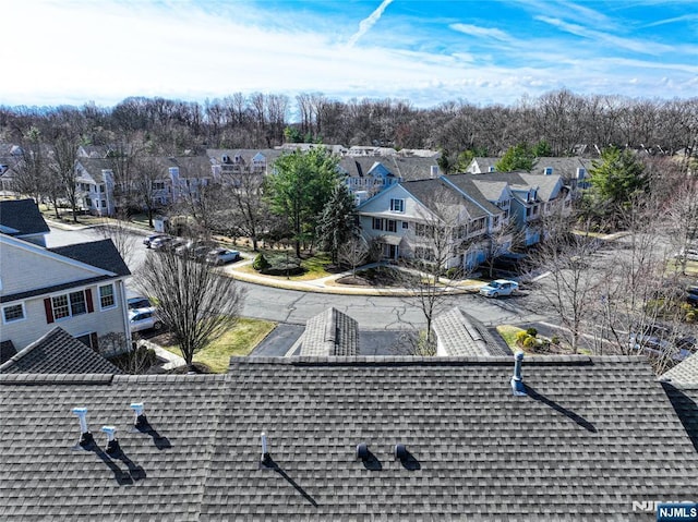 birds eye view of property with a residential view