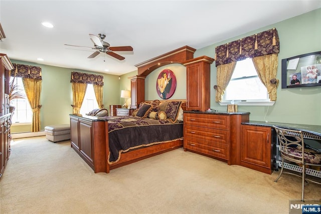 bedroom featuring a ceiling fan, recessed lighting, light colored carpet, and a baseboard radiator