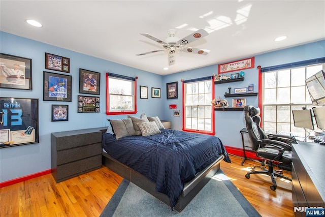 bedroom featuring recessed lighting, a ceiling fan, baseboards, and wood finished floors