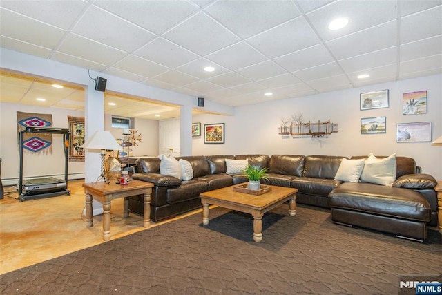 living room with recessed lighting and a paneled ceiling