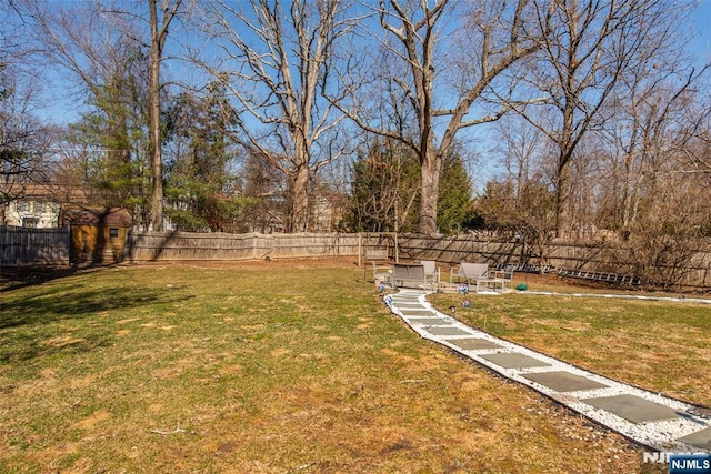 view of yard with a fenced backyard